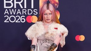 Wet Leg’s Rhian Teasdale arrives at the BRIT Awards with bloodied knees as she makes a bizarre red carpet appearance
